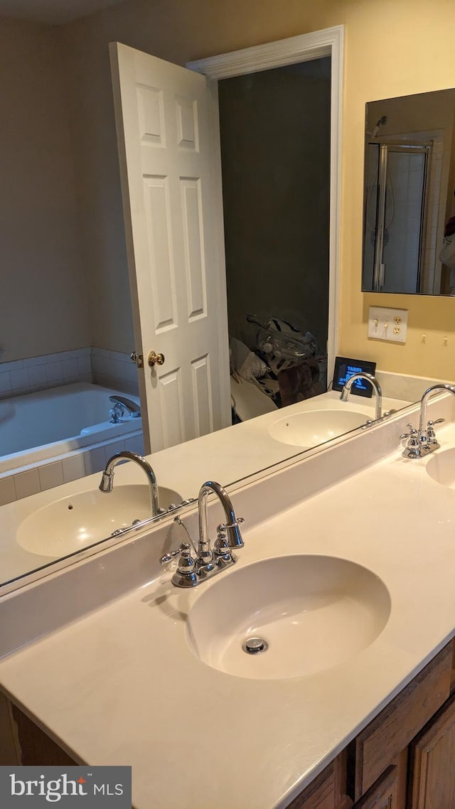 bathroom with plus walk in shower and vanity