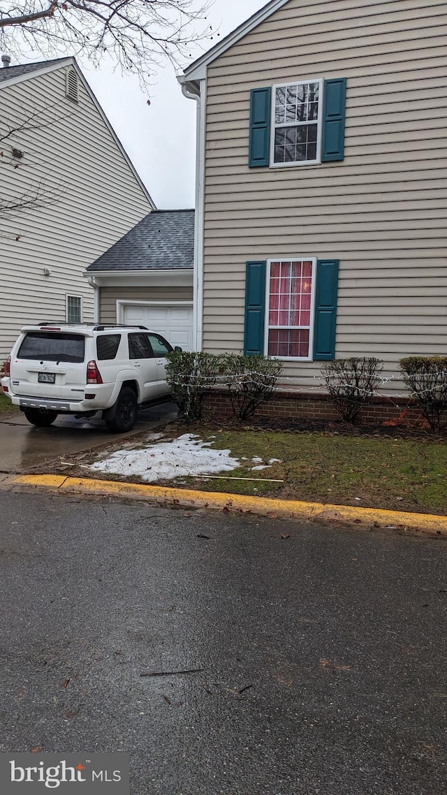 view of property exterior featuring a garage