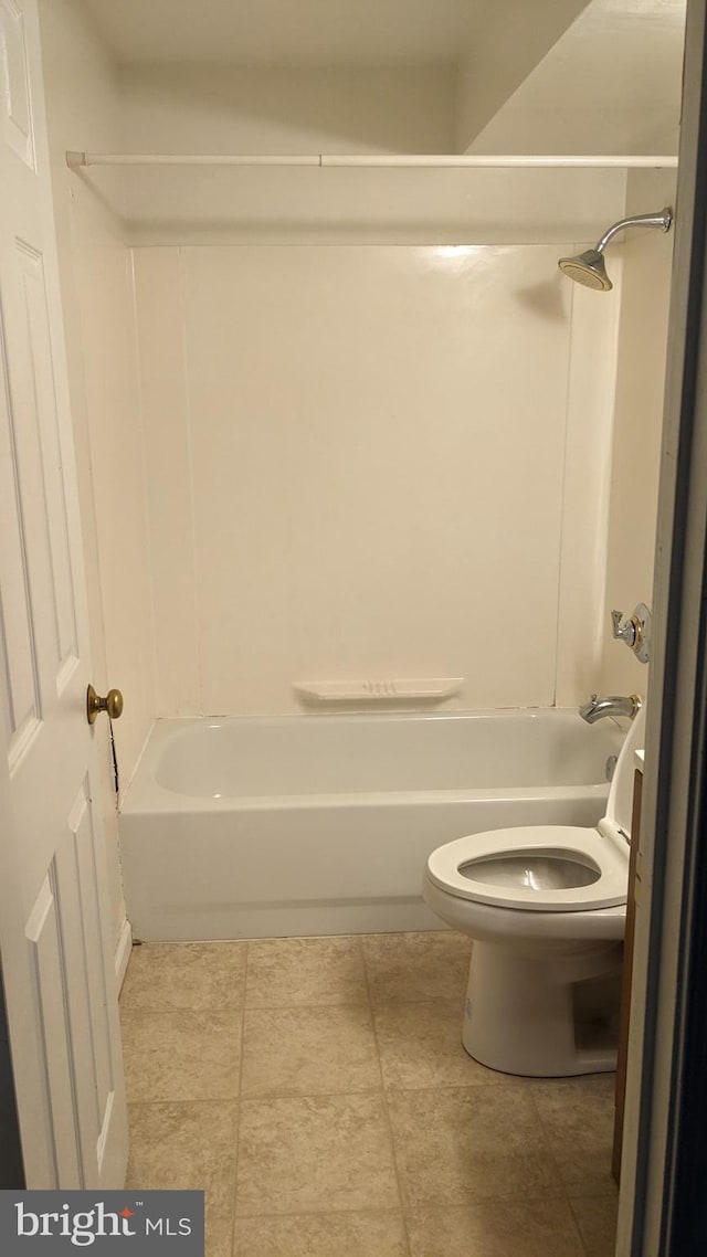 bathroom with shower / tub combination and toilet