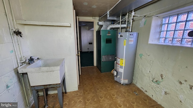 utility room with water heater, sink, and heating unit