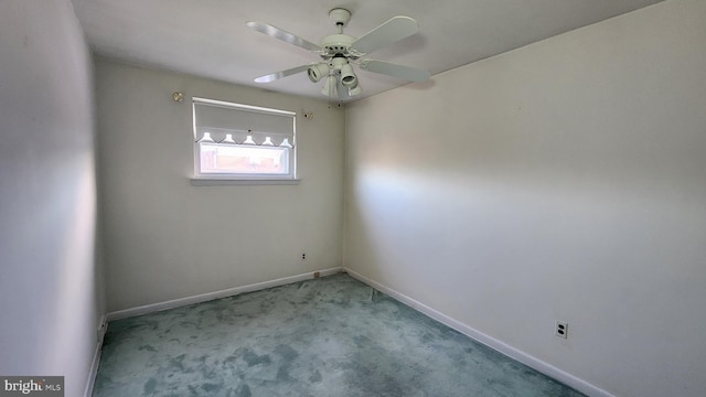 spare room featuring ceiling fan and light colored carpet