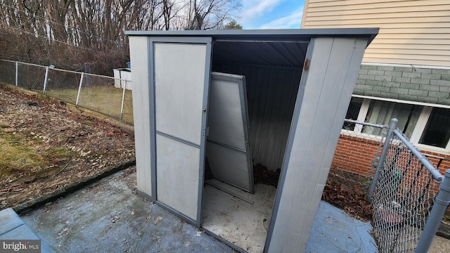 exterior space featuring a storage unit