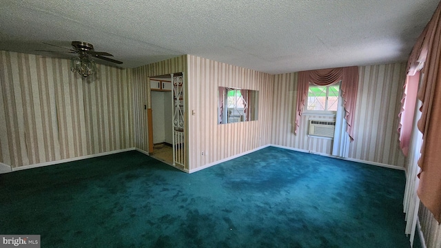 carpeted empty room featuring cooling unit, ceiling fan, and a textured ceiling