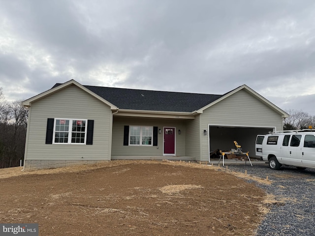 ranch-style home featuring a garage