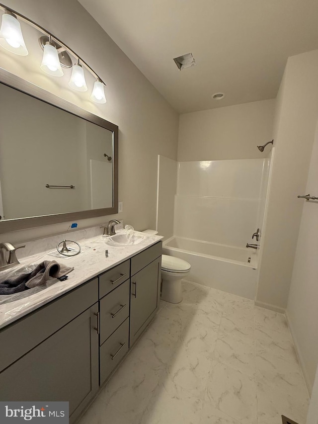 full bathroom featuring vanity, toilet, and bathtub / shower combination