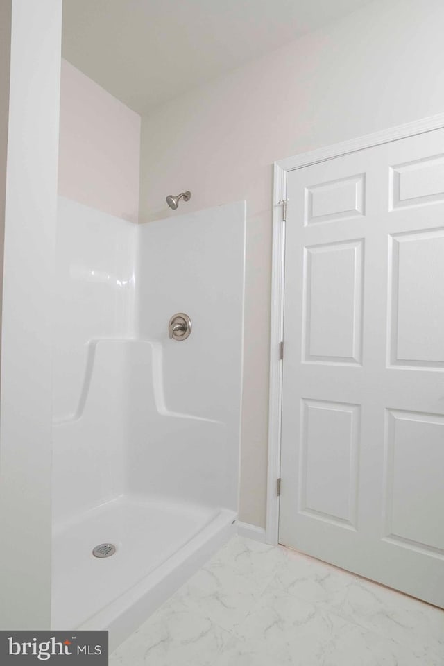 bathroom featuring walk in shower