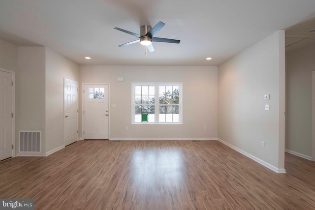 interior space featuring hardwood / wood-style floors and ceiling fan