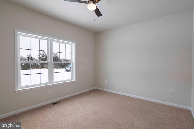 carpeted empty room with ceiling fan