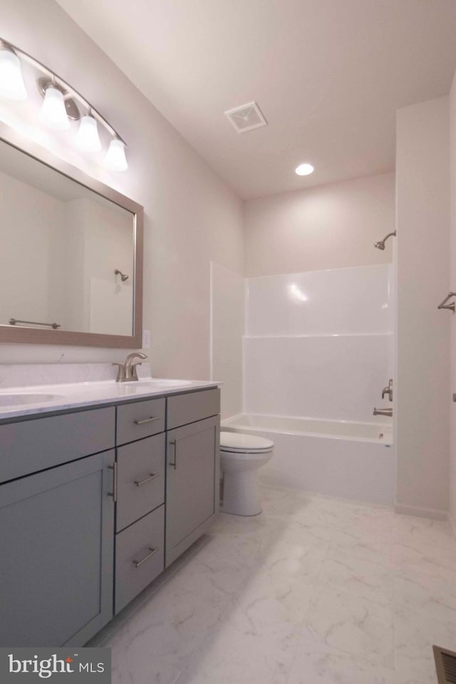 full bathroom with vanity, bathing tub / shower combination, and toilet