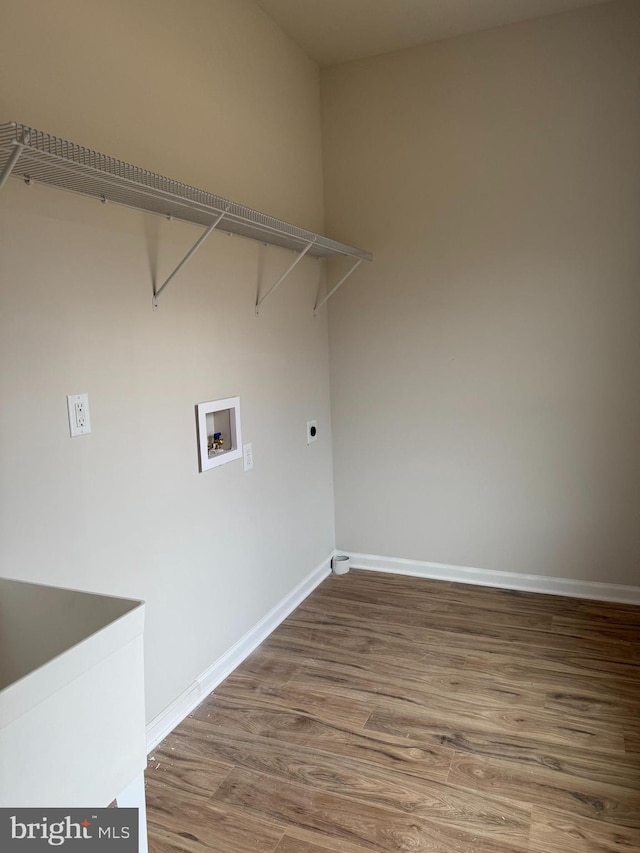 laundry room featuring hookup for a washing machine, electric dryer hookup, and hardwood / wood-style floors