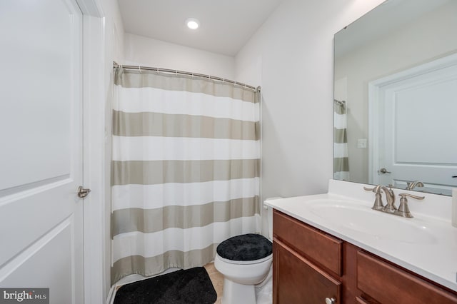 bathroom with vanity and toilet