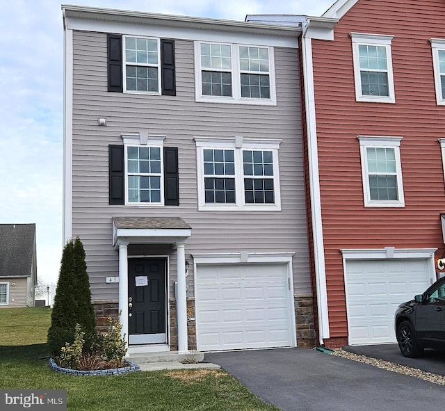 multi unit property featuring a garage