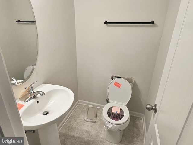 bathroom with toilet and sink