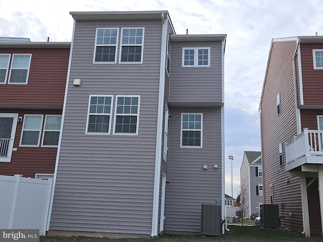 back of house with central AC