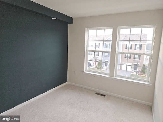 empty room featuring carpet floors