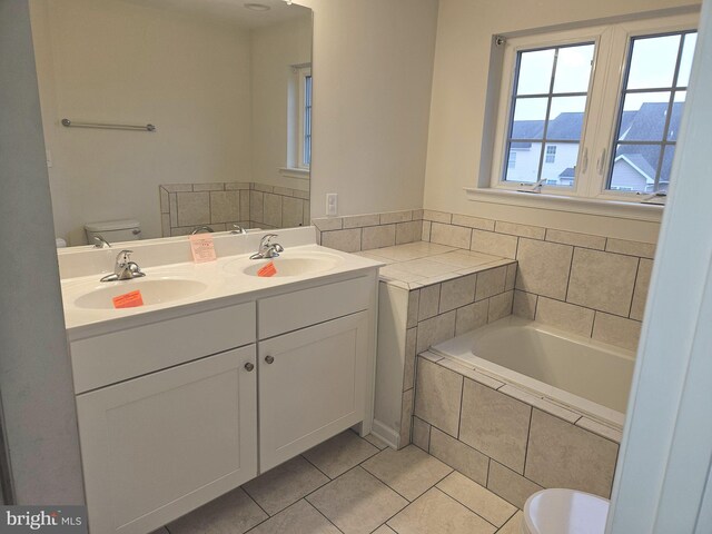 bathroom with a mountain view, tile patterned flooring, vanity, and toilet