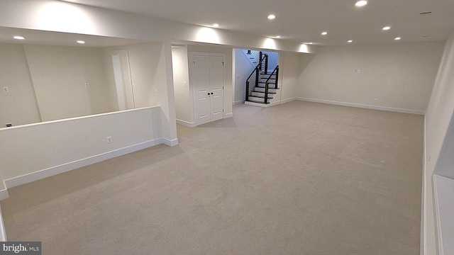 basement with light colored carpet