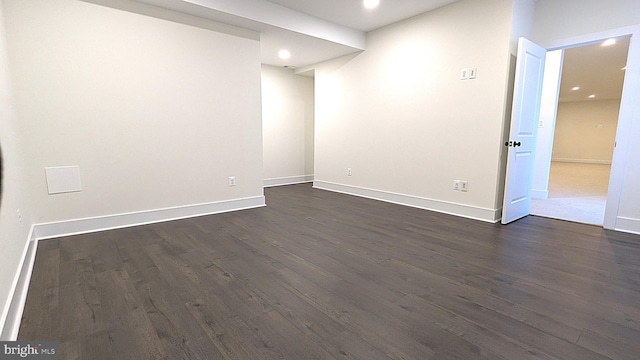 spare room featuring dark hardwood / wood-style floors