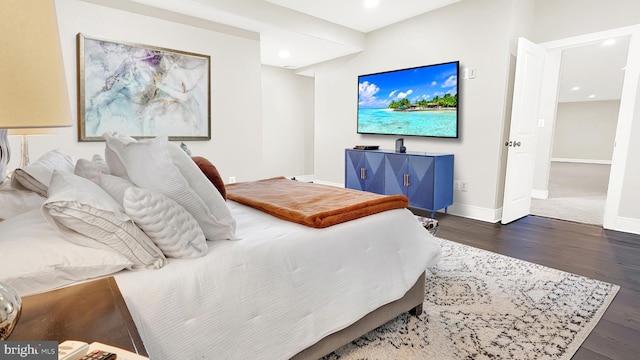 bedroom featuring dark wood-type flooring