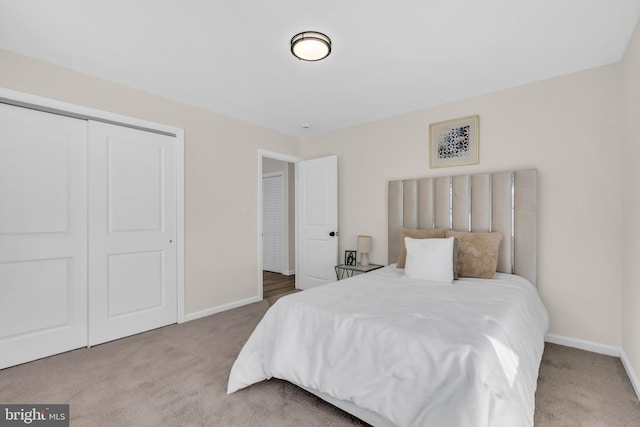 carpeted bedroom with a closet