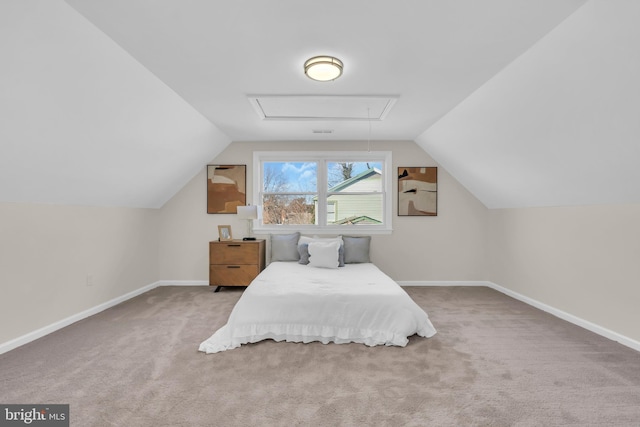 carpeted bedroom featuring lofted ceiling