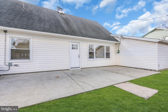 property entrance featuring a yard and a patio area