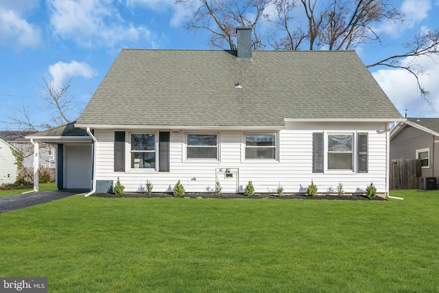 cape cod house featuring a garage, a front lawn, and central air condition unit