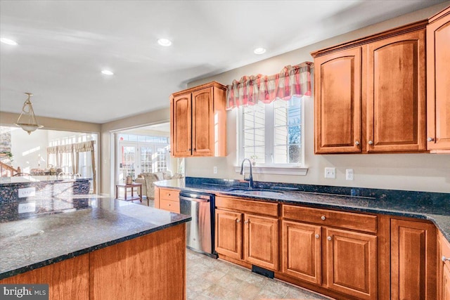 kitchen with dishwasher, french doors, dark stone counters, and sink