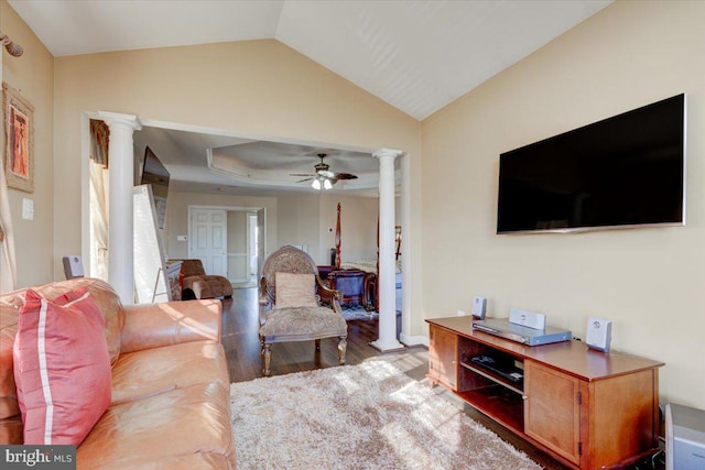 living room with hardwood / wood-style flooring, vaulted ceiling, ceiling fan, and decorative columns