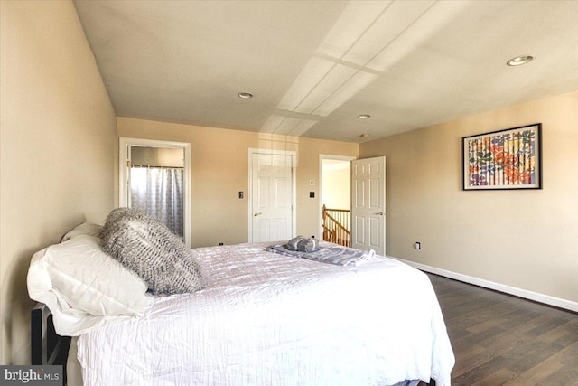 bedroom with dark hardwood / wood-style floors