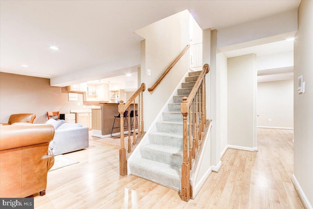 staircase featuring hardwood / wood-style floors