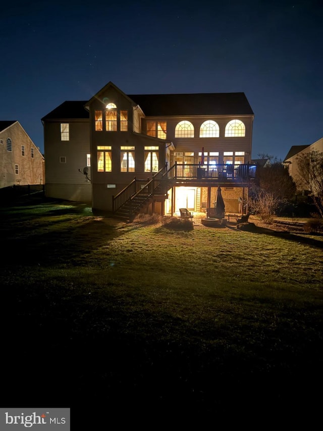 view of back house at twilight