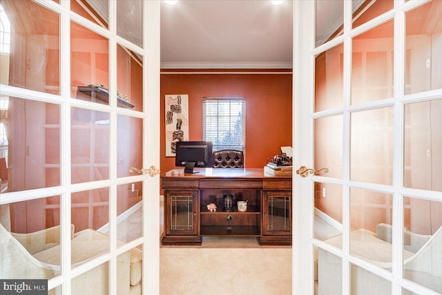 carpeted home office with french doors and ornamental molding