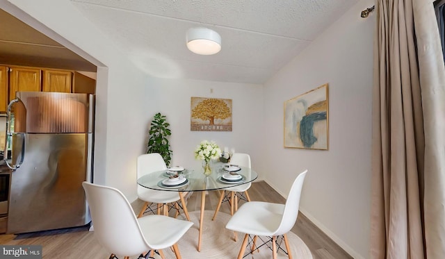 dining room featuring light hardwood / wood-style flooring