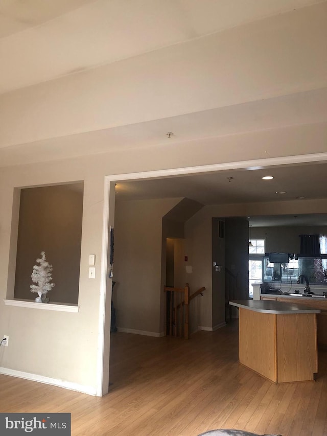 kitchen featuring light brown cabinets and light hardwood / wood-style floors