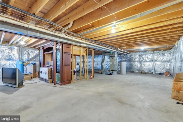 basement featuring heating unit and gas water heater