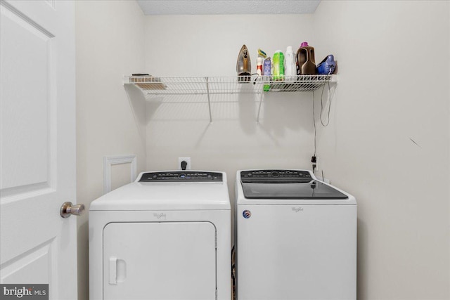 laundry room with washing machine and dryer