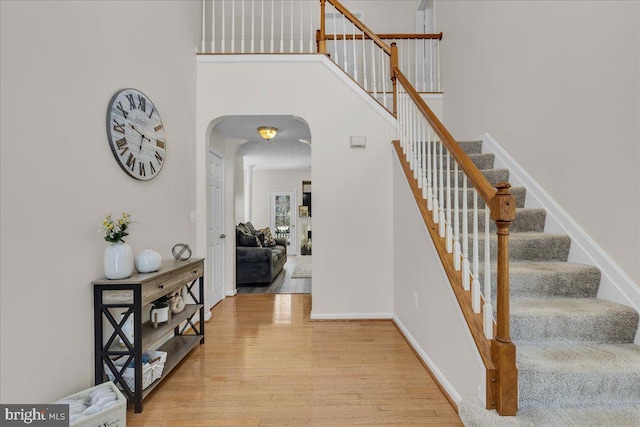 stairway featuring hardwood / wood-style floors