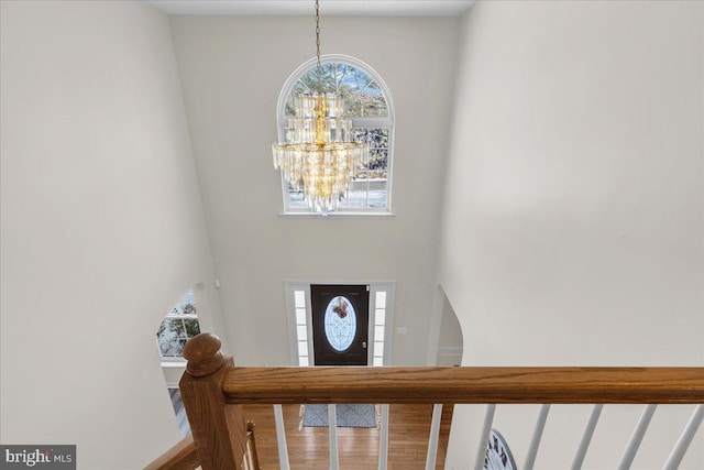 foyer entrance featuring an inviting chandelier