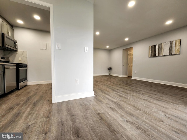 unfurnished living room with hardwood / wood-style flooring