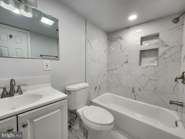 full bathroom with vanity, toilet, and tiled shower / bath combo