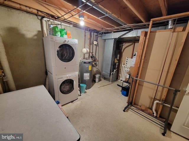 laundry area with electric water heater and stacked washer / drying machine