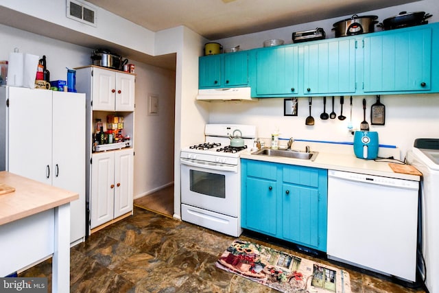 kitchen with blue cabinetry, washer / clothes dryer, sink, and white appliances