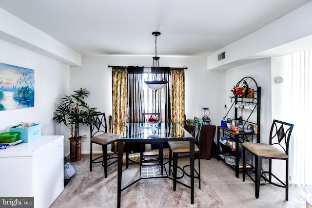 dining space with carpet floors