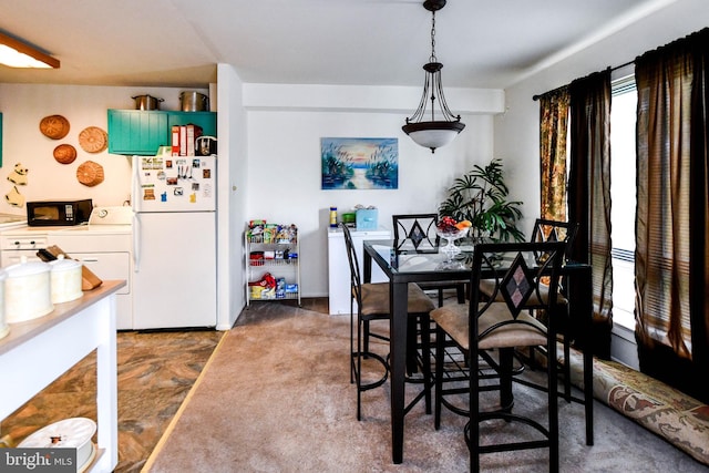 dining room featuring washer / dryer