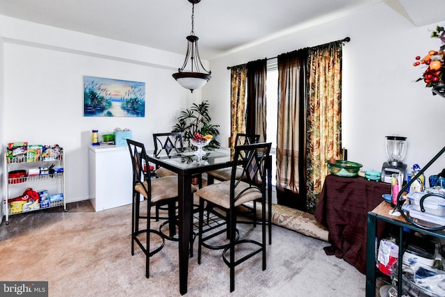 view of carpeted dining area