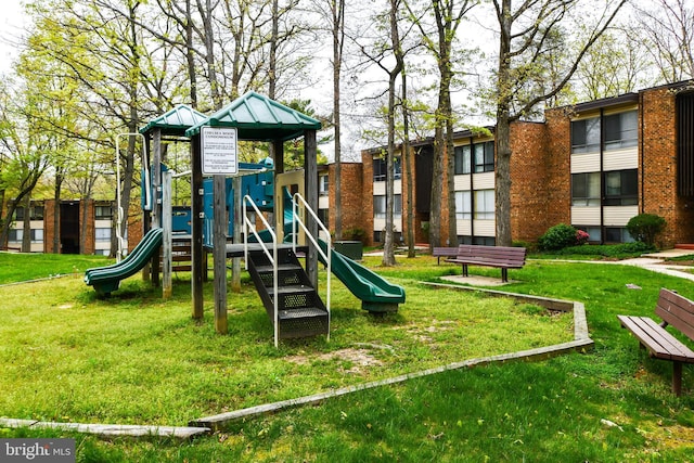 view of play area featuring a lawn