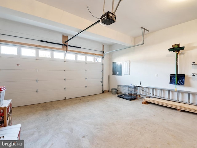 garage featuring electric panel and a garage door opener