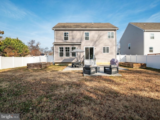 back of house with a patio and a lawn