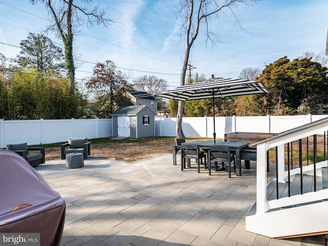 view of patio with a storage shed